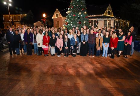 A group of people posing for a photoDescription automatically generated